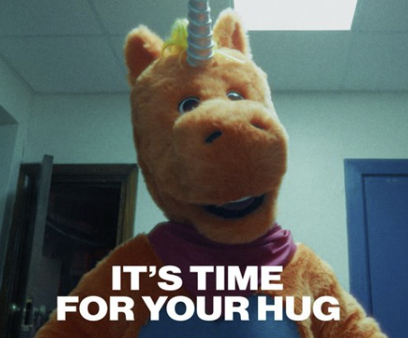 Buddy leaning toward the camera above the caption ‘It's time for your hug.’